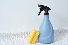 Blue Bottle Of Spray For Cleaning Windows And Surfaces And A Rag