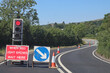 Waiting at roadworks controlled by traffic lights in Somerset, England. No traffic is approaching from the opposite direction