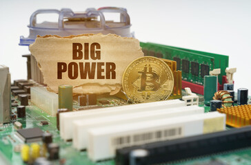 Poster - On the motherboard lies a bitcoin coin and a cardboard sign with the inscription - big power