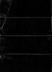 Poster - Folded paper with grungy texture in black background. can be used to replicate the aged and worn look for your creative design. old paper for photo texture overlay in retro style