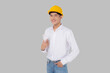 Portrait young asian man is engineer wearing helmet standing and holding blueprint with confident isolated on white background, handsome male is architect or contractor, worker or labor concept.