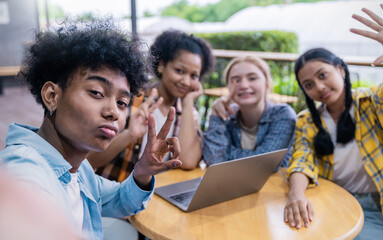 Portrait of teenage student using smartphone selfie say hi at high school or university. The group of happy fun teenager making selfie in classroom. Teamwork of cool kid  using computer to do project