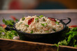 cumin rice,jeera rice famous indian rice dish served in a bowl closeup with selective focus and blur