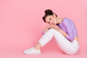 Sticker - Profile side view portrait of attractive cheerful brown-haired tender girl sitting on floor ad isolated over pink pastel color background