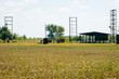 © andrew_shots - Empty shotgun training field with green grass and plat machines