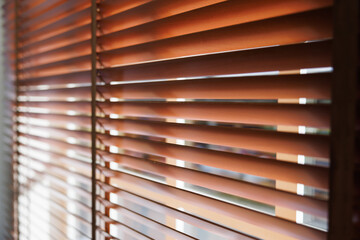 Sticker - Wooden shutters blind with soft focus. light and shadow on  blind curtain decorate in office.