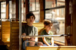 © Anastasia Amraeva - two boys, two brothers ride a tram through the city. Children ride on public transport