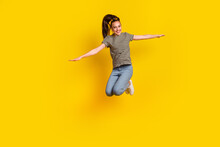 Full Length Body Size Photo Of Jumping High Female Student Gesturing Arms Flying Isolated On Bright Color Background