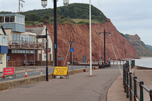 The Road Is Closed By The Lifeboat Station In Sidmouth. This Is A Privately Funded Charity, Not Part Of The RNLI. The Boat Club And The Jurassic Cliffs Can Be Seen In The Background