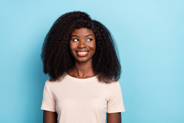 Sticker - Photo of pretty positive lady toothy smile look interested empty space ad isolated on blue color background