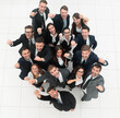 © ASDF - concept of success. business team raising hands and looking at camera.