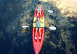 © Jade Maas/peopleimages.com - Above view of two smiling friends kayaking on the ocean together over summer break. Portrait of happy women canoeing and bonding outside in nature with water activity. Having fun on a kayak