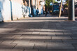 Blur sidewalk with pavement in an urban area with traffic in daytime