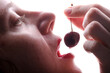 © Denis Kadatsky - female lips and cherry berry on a white background