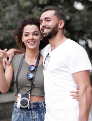 Poster - Cheerful young couple walking on urban street