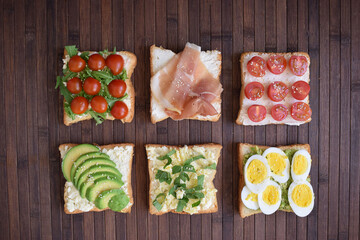 Wall Mural - Healthy toast for breakfast with avocado, eggs, tomatoes, arugula etc