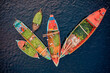 © AmazingAerialAgency - Aerial view of people working on commercial boats with fruits, Buriganga river, Keraniganj, Dhaka, Bangladesh.