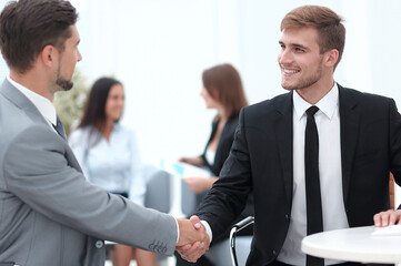 Poster - handshake Manager and the client in the office.