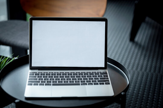 Business concept : White notebook screen background to put advertising text selling marketing products in the coffee shop, mock up, sales and text.