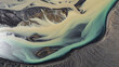 © AmazingAerialAgency - Aerial view of water formation along the river estuary in Iceland.