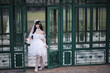 © Oran Tantapakul - Beautiful young woman with white lolita dress with european garden Japanese fashion