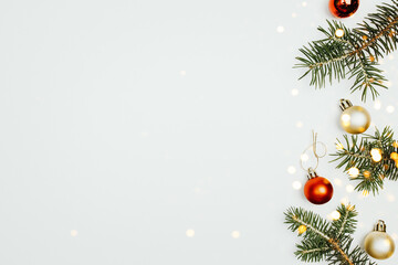 Wall Mural - fir branches christmas balls on a white background top view.