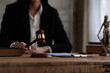 © David - justice and law concept.a female judge in a courtroom on a wooden table and a Counselor or female lawyer working in an office. Legal law, advice, and justice concept.