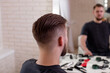 
Male head with stylish haircut on barbershop background