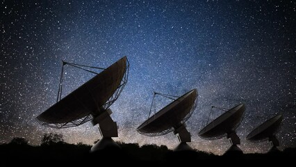 Wall Mural - many radar telescopes at night observing signal from stars.