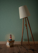 A Vintage Lamp Looks Down On A Lighthouse
