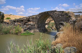 Jisr el-Majami or Meeting Bridge, an ancient basalt bridge of Roman origin, over the Jordan River on the border Israel and Jordan. The bridge was damaged during 1948 Arab-Israeli War and was renovated