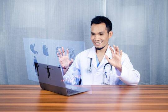 Asian Doctors use computer graphics to research patients' treatment in hospital