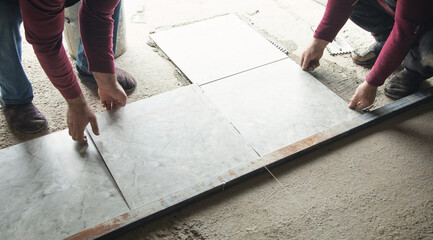 Laying floor ceramic tile. Renovating the floor