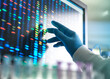 © Connect Images - Scientist matching DNA sample to results on screen