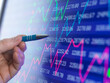 © Connect Images - Stock trader viewing performance of shares on screen