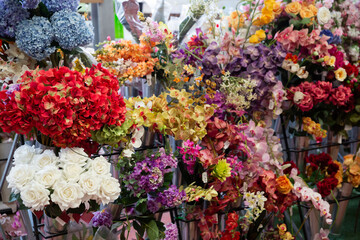 artificial flowers prepared for sale on display in shop