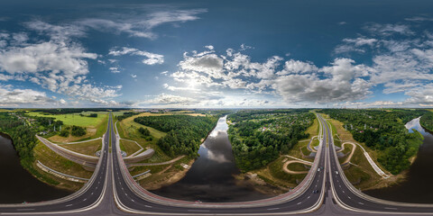 aerial full spherical seamless hdr 360 panorama over huge road junction and bridge over river of freeway at height of 100 meters at susnset in equirectangular projection, VR AR content