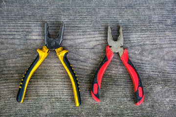 Old pliers with plastic handles.