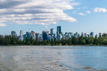 Wall Mural - A view across Stanley Park towards the skyline of Vancouver, Canada in summertime