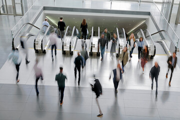 Wall Mural - people on moving escalator motion blur