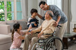 © karunyapas - Young asian couple and child visiting grandparents in nursing home