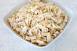 Canned shredded jackfruit pieces on a plate. Great vegan fruit substitution for meat.
