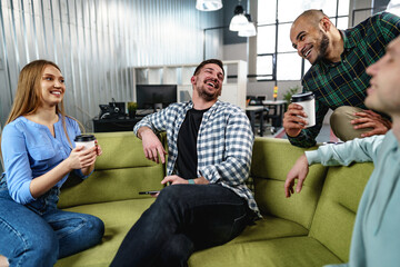 Young businesspeople talking during their office coffee break