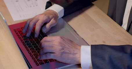 Leinwandbilder - Close-up of a man's hands typing text on a laptop keyboard. He makes an email. Using speed dial, computer technology. Using Wi-Fi at the table, messenger application.