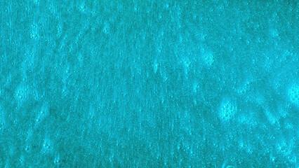 Poster - Bright turquoise background with bubbles moving slowly. Beautiful blue surface with shining particles flowing.