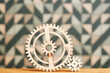 Mechanism with big and small wooden gears on a the table. Complex system concept. Kids toy