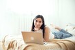 © therabbithole - Portrait Of A Young Woman Working On Laptop Computer.