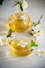 Poster - Composition with cup of jasmine tea and flowers