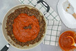 Fried ground beef and marinara sauce close up on frying pan. Step by step beef lasagna recipe, close up preparation process