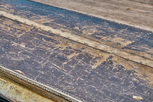 Close Up Shot Of The Rusty Metal Bottom Of A Rowing Boat Witht Scratches Brown